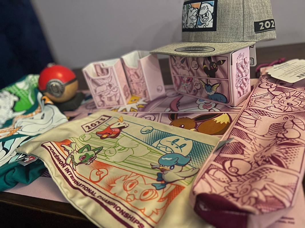 A selection of Pokémon International Championships swag, and items from the Pokémon Center pop-up store