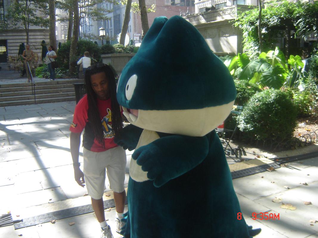 Costumed Pokémon were present in Bryant Park; this photograph shows a very happy Munchlax with a member of the staff at the event
